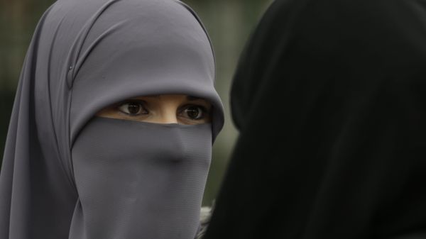 A Muslim woman talks with a friend during events to observe World Hijab Day, celebrating the veil traditionally worn by Muslim women A Muslim woman talks with a friend during events to observe World Hijab Day, celebrating the veil traditionally worn by Muslim women - Sputnik International