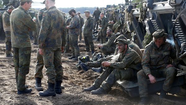 German army soldiers rest after NATO enchanced Forward Presence Battle Group Lithuania exercise in Pabrade military training field, Lithuania, May 17, 2017 - Sputnik International