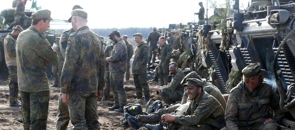 German army soldiers rest after NATO enchanced Forward Presence Battle Group Lithuania exercise in Pabrade military training field, Lithuania, May 17, 2017 - Sputnik International