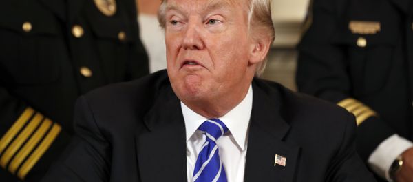 President Donald Trump, flanked by members of law enforcement, speaks before signing bills in the Diplomatic Reception Room at the White House - Sputnik International