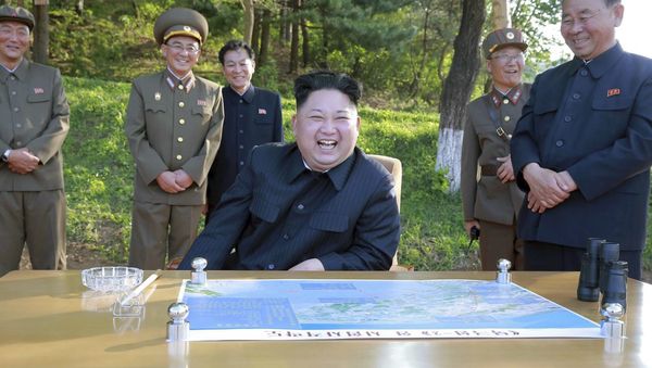 North Korean leader Kim Jong Un watches the test launch of a solid-fuel Pukguksong-2 at an undisclosed location in North Korea - Sputnik International
