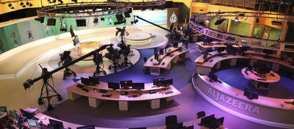 Staff members of Al-Jazeera International work at the news studio in Doha, Qatar (File) Staff members of Al-Jazeera International work at the news studio in Doha, Qatar (File) - Sputnik International
