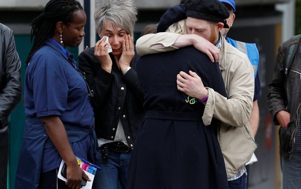 People react in front of floral tributes on the south side of London Bridge near Borough Market after an attack left 7 people dead and dozens of injured in London, Britain, June 5, 2017. - Sputnik International