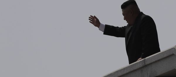 North Korean leader Kim Jong Un is seen in silhouette as he waves during a military parade in Pyongyang, North Korea North Korean leader Kim Jong Un is seen in silhouette as he waves during a military parade in Pyongyang, North Korea - Sputnik International