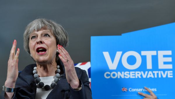 Britain's Prime Minister Theresa May delivers a speech during an election campaign visit to Langton Rugby Club in Stoke-on-Trent, June 6, 2017. Britain's Prime Minister Theresa May delivers a speech during an election campaign visit to Langton Rugby Club in Stoke-on-Trent, June 6, 2017. - Sputnik International