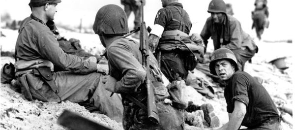 In this June 6, 1944 file photo, first wave beach battalion Ducks lay low under the fire of Nazi guns on the beach of southern France on D-Day, June 6, 1944 during World War II. One invader operates a walkie talkie radio directing other landing craft to the safest spots for unloading their parties of fighting men. - Sputnik International