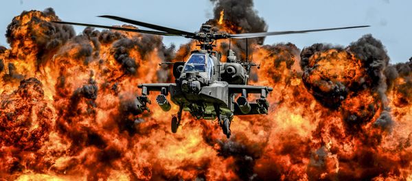 An AH-64D Apache attack helicopter flies in front of a wall of fire during the South Carolina National Guard Air and Ground Expo at McEntire Joint National Guard Base, South Carolina, U.S. on May 6, 2017 An AH-64D Apache attack helicopter flies in front of a wall of fire during the South Carolina National Guard Air and Ground Expo at McEntire Joint National Guard Base, South Carolina, U.S. on May 6, 2017 - Sputnik International