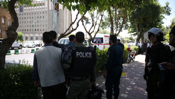 Iranian police stand near the parliament's building during a gunmen attack in central Tehran, Iran, June 7, 2017 - Sputnik International