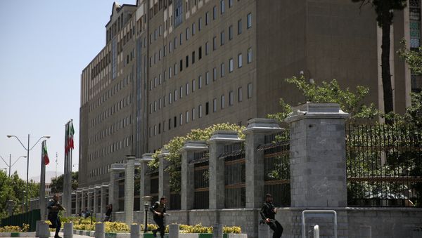 Members of Iranian forces run during a gunmen attack at the parliament's building in central Tehran, Iran, June 7, 2017 Members of Iranian forces run during a gunmen attack at the parliament's building in central Tehran, Iran, June 7, 2017 - Sputnik International