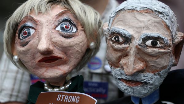 Puppets of Conservative Party leader Theresa May and Labour Party leader Jeremy Corbyn are seen during a protest against the BBC's broadcast restrictions on the Captain Ska song Liar Liar outside Broadcasting House in London, Britain June 2, 2017. - Sputnik International