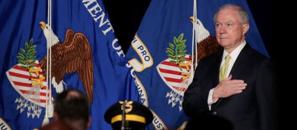 U.S. Attorney General Jeff Sessions is seen on stage as the Atlanta Police Department Honor Guard presents the colors while the National Anthem is played at the National Law Enforcement Conference on Human Exploitation in Atlanta, Georgia, U.S., June 6, 2017 - Sputnik International