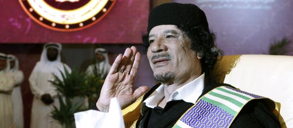 Libyan leader Moammar Gadhafi gestures during the Arab summit in Doha, Qatar, Monday, March 30, 2009 - Sputnik International