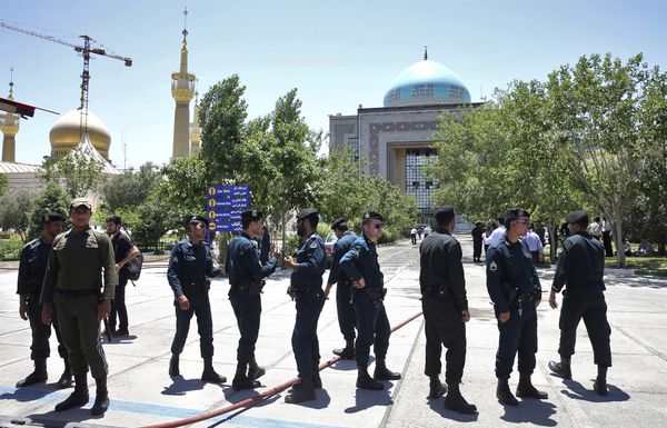 Police officers control the scene, around of shrine of late Iranian revolutionary founder Ayatollah Khomeini, after an assault of several attackers in Tehran, just outside Tehran, Iran, Wednesday, June 7, 2017 - Sputnik International