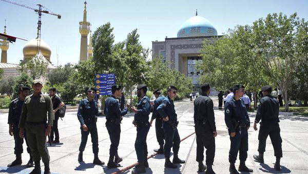 Police officers control the scene, around of shrine of late Iranian revolutionary founder Ayatollah Khomeini, after an assault of several attackers in Tehran, just outside Tehran, Iran, Wednesday, June 7, 2017 Police officers control the scene, around of shrine of late Iranian revolutionary founder Ayatollah Khomeini, after an assault of several attackers in Tehran, just outside Tehran, Iran, Wednesday, June 7, 2017 - Sputnik International