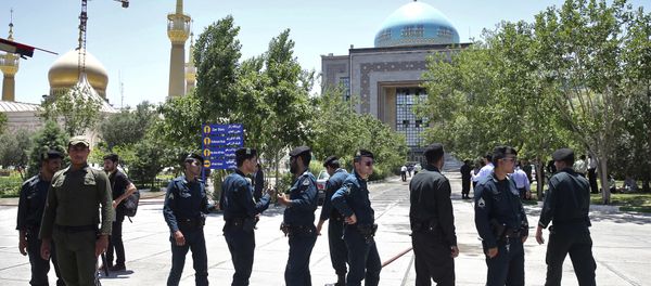 Police officers control the scene, around of shrine of late Iranian revolutionary founder Ayatollah Khomeini, after an assault of several attackers in Tehran, just outside Tehran, Iran, Wednesday, June 7, 2017 - Sputnik International