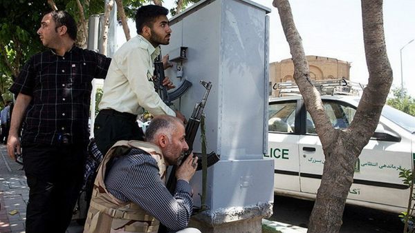 Members of Iranian forces take cover during an attack on the Iranian parliament in central Tehran, Iran, June 7, 2017 Members of Iranian forces take cover during an attack on the Iranian parliament in central Tehran, Iran, June 7, 2017 - Sputnik International