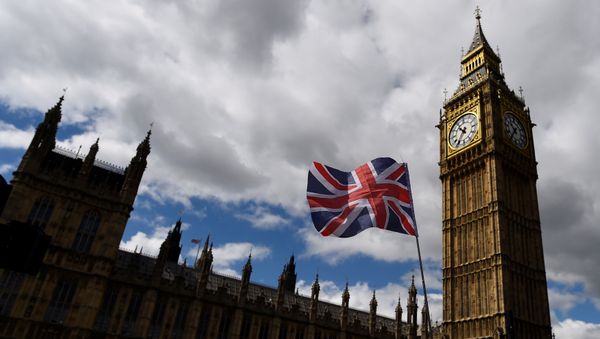 The Union Flag flies near the Houses of Parliament the day before a general election in central London, Britain June 7, 2017. - Sputnik International