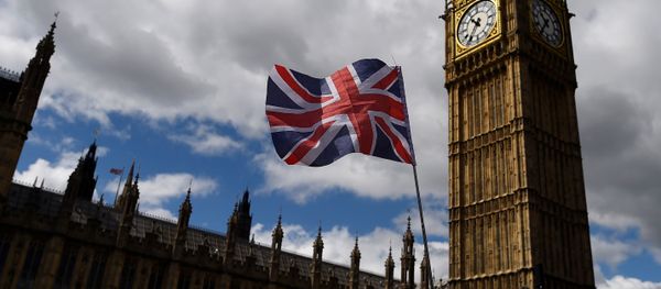 The Union Flag flies near the Houses of Parliament the day before a general election in central London, Britain June 7, 2017. - Sputnik International