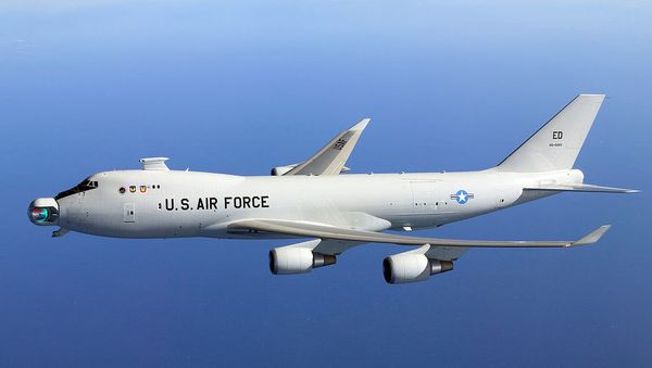 The since-abandoned YAL-1A Airborne Laser system in flight with its mirror unstowed - Sputnik International
