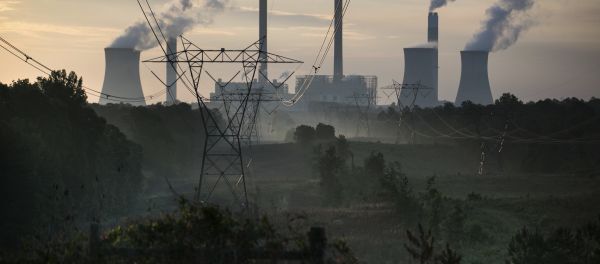 The coal-fired Plant Scherer, one of the nation's top carbon dioxide emitters, stands in the distance in Juliette, Ga., Saturday, June, 3, 2017. U.S. President Donald Trump declared Thursday he was pulling the U.S. from the landmark Paris climate agreement, striking a major blow to worldwide efforts to combat global warming and distancing the country from its closest allies abroad. - Sputnik International
