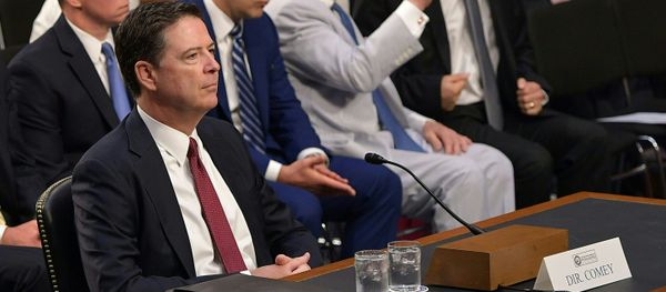 Former FBI Director James Comey arrives to testify during a US Senate Select Committee on Intelligence hearing on Capitol Hill in Washington,DC, June 8, 2017. Former FBI Director James Comey arrives to testify during a US Senate Select Committee on Intelligence hearing on Capitol Hill in Washington,DC, June 8, 2017. - Sputnik International