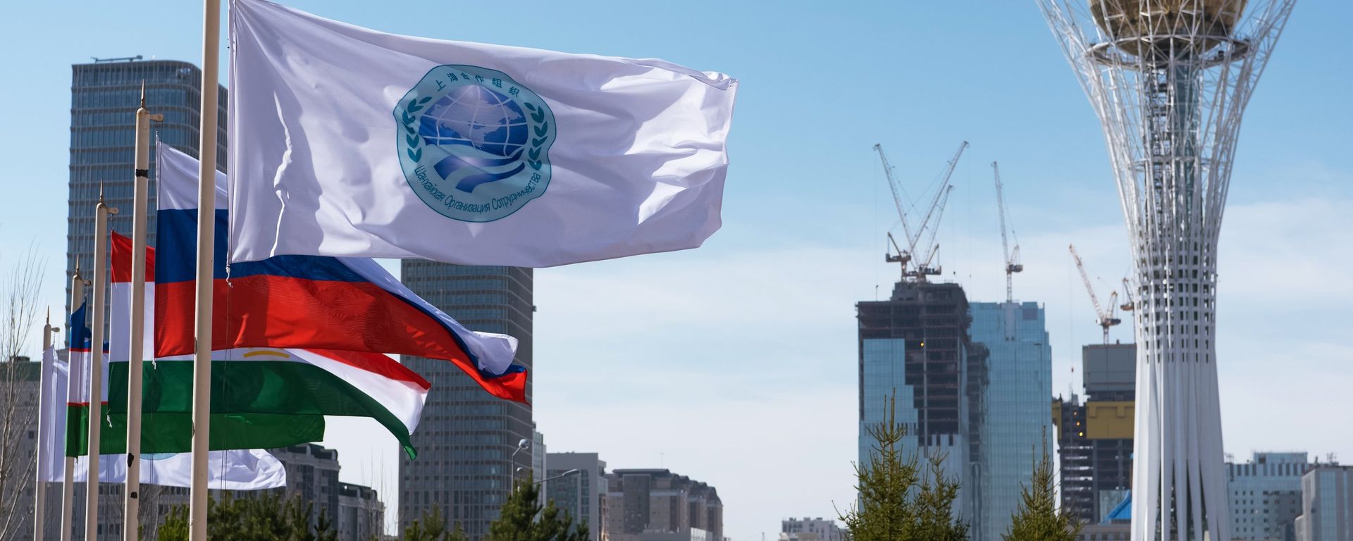 The flag of the Shanghai Cooperation Organization and flags of the SCO member states in Astana - Sputnik International, 1920, 17.09.2026