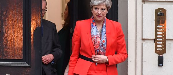 British Prime Minister Theresa May leaves the Conservative Party HQ in central London, on June 9, 2017, hours after the polls closed in the British general election. British Prime Minister Theresa May leaves the Conservative Party HQ in central London, on June 9, 2017, hours after the polls closed in the British general election. - Sputnik International