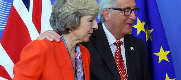 British Prime Minister Theresa May (L) is welcomed by European Commission President Jean-Claude Juncker at the EC headquarters in Brussels, Belgium October 21, 2016. British Prime Minister Theresa May (L) is welcomed by European Commission President Jean-Claude Juncker at the EC headquarters in Brussels, Belgium October 21, 2016. - Sputnik International