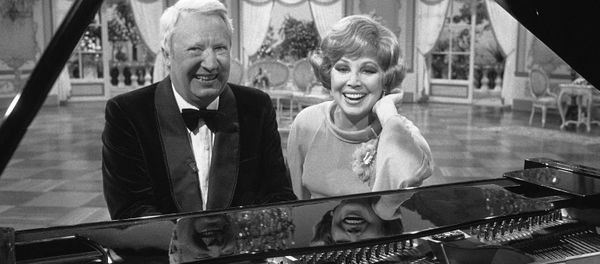 Former British Prime Minister Edward Heath and West German opera singer Anneliese Rothenberger pose sitting at a piano during an interval in shooting for a Television show in Hamburg, West Germany on May 17, 1977. - Sputnik International