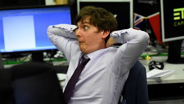An ETX Capital trader reacts as he watches the results for Britain's election in London, June 8, 2017. An ETX Capital trader reacts as he watches the results for Britain's election in London, June 8, 2017. - Sputnik International