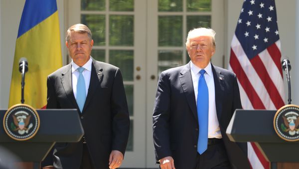 President Donald Trump, accompanied by Romanian President Klaus Werner Iohannis, walk to the dais to begin a news conference in the Rose Garden at the White House, Friday, June 9, 2017, in Washington. President Donald Trump, accompanied by Romanian President Klaus Werner Iohannis, walk to the dais to begin a news conference in the Rose Garden at the White House, Friday, June 9, 2017, in Washington. - Sputnik International