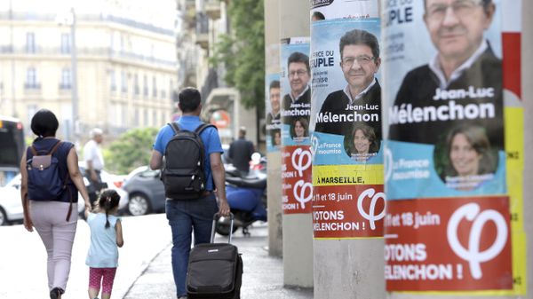 People walk past near posters of Jean-Luc Melenchon, a former hard-left candidate in the first round of the presidential election, candidate for the upcoming legislative elections, at the Belsunce district, in Marseille, southern France People walk past near posters of Jean-Luc Melenchon, a former hard-left candidate in the first round of the presidential election, candidate for the upcoming legislative elections, at the Belsunce district, in Marseille, southern France - Sputnik International