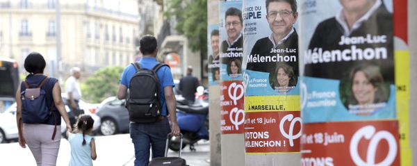 People walk past near posters of Jean-Luc Melenchon, a former hard-left candidate in the first round of the presidential election, candidate for the upcoming legislative elections, at the Belsunce district, in Marseille, southern France People walk past near posters of Jean-Luc Melenchon, a former hard-left candidate in the first round of the presidential election, candidate for the upcoming legislative elections, at the Belsunce district, in Marseille, southern France - Sputnik International