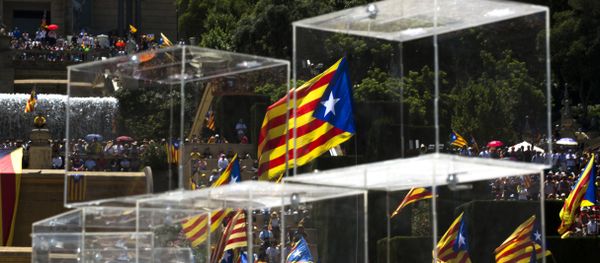 People wave pro independence flags next to ballot boxes during a protest organised by the National Assembly for Catalonia, to support the call for referendum in Barcelona, Spain People wave pro independence flags next to ballot boxes during a protest organised by the National Assembly for Catalonia, to support the call for referendum in Barcelona, Spain - Sputnik International