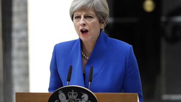 British Prime Minister Theresa May addresses the press in Downing street, London, Friday, June 9, 2017 following an audience with Britain's Queen Elizabeth II at Buckingham Palace where she asked to form a government. British Prime Minister Theresa May addresses the press in Downing street, London, Friday, June 9, 2017 following an audience with Britain's Queen Elizabeth II at Buckingham Palace where she asked to form a government. - Sputnik International