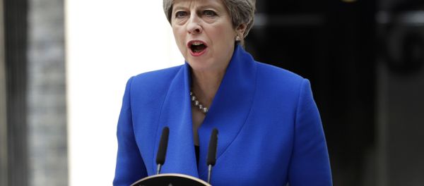 British Prime Minister Theresa May addresses the press in Downing street, London, Friday, June 9, 2017 following an audience with Britain's Queen Elizabeth II at Buckingham Palace where she asked to form a government. British Prime Minister Theresa May addresses the press in Downing street, London, Friday, June 9, 2017 following an audience with Britain's Queen Elizabeth II at Buckingham Palace where she asked to form a government. - Sputnik International