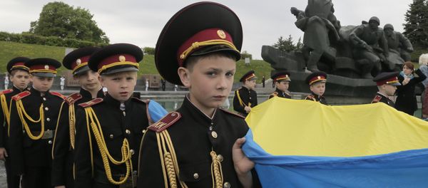Military cadets carry the Ukrainian National flag during a parade of Kiev military schools, within the program of military and patriotic education, to celebrate Victory Day at the WWII memorial in Kiev, Ukraine, Tuesday, May 5, 2015 Military cadets carry the Ukrainian National flag during a parade of Kiev military schools, within the program of military and patriotic education, to celebrate Victory Day at the WWII memorial in Kiev, Ukraine, Tuesday, May 5, 2015 - Sputnik International