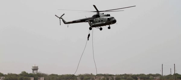 Garud commandos of Indian air force performs from an MI-8 helicopter during the inducting ceremony of first Medium Power Radar (MPR) named Arudhra, seen background, at the Air Force Station Naliya (File) Garud commandos of Indian air force performs from an MI-8 helicopter during the inducting ceremony of first Medium Power Radar (MPR) named Arudhra, seen background, at the Air Force Station Naliya (File) - Sputnik International