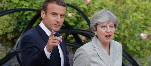 French President Emmanuel Macron (L) escorts Britain's Prime Minister Theresa May as they arrive to speak to the press at the Elysee Palace in Paris, France, June 13, 2017 - Sputnik International