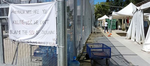 A sign adorns the security fence near shelters inside the Manus Island detention centre in Papua New Guinea, February 11, 2017 A sign adorns the security fence near shelters inside the Manus Island detention centre in Papua New Guinea, February 11, 2017 - Sputnik International