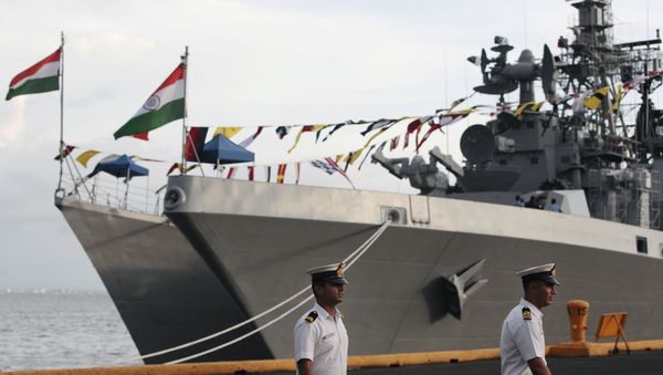 Indian sailors walk beside Indian Navy ships, from left, INS Ranvijay (D55), a Rajput class destroyer, and INS Saptura, a Shivalik-class stealth multi-role frigate, as they arrive at Berth 15, South Harbour, in Manila, Philippines on Wednesday, June 12, 2013 Indian sailors walk beside Indian Navy ships, from left, INS Ranvijay (D55), a Rajput class destroyer, and INS Saptura, a Shivalik-class stealth multi-role frigate, as they arrive at Berth 15, South Harbour, in Manila, Philippines on Wednesday, June 12, 2013 - Sputnik International