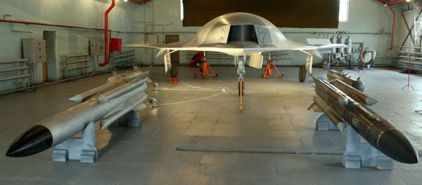 A full-sized model of the unmanned aerial vehicle Skat (background) and Kh-31 guided missiles (foreground) in a hangar of the Russian Aircraft Corporation MiG, the 8th MAKS-2007 air show in Zhukovsky A full-sized model of the unmanned aerial vehicle Skat (background) and Kh-31 guided missiles (foreground) in a hangar of the Russian Aircraft Corporation MiG, the 8th MAKS-2007 air show in Zhukovsky - Sputnik International
