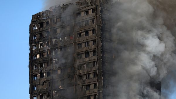 Smoke billows as firefighters tackle a serious fire in a tower block at Latimer Road in West London, Britain June 14, 2017. Smoke billows as firefighters tackle a serious fire in a tower block at Latimer Road in West London, Britain June 14, 2017. - Sputnik International