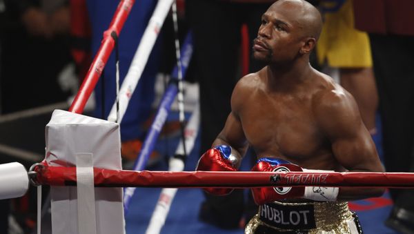 Floyd Mayweather Jr. enters the ring before his welterweight title fight against Manny Pacquiao, from the Philippines, on Saturday, May 2, 2015 in Las Vegas. Floyd Mayweather Jr. enters the ring before his welterweight title fight against Manny Pacquiao, from the Philippines, on Saturday, May 2, 2015 in Las Vegas. - Sputnik International