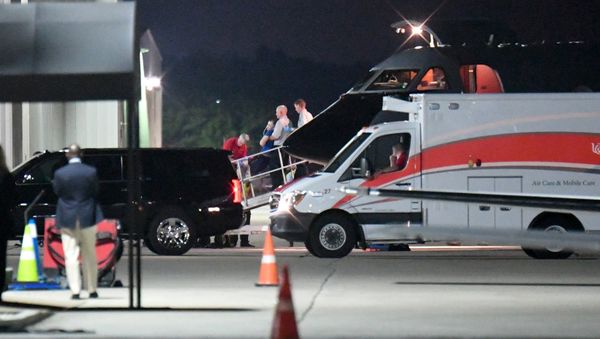 A person believed to be Otto Warmbier is transferred from a medical transport airplane to an awaiting ambulance at Lunken Airport in Cincinnati, Ohio, U.S., June 13, 2017 - Sputnik International