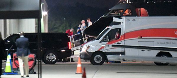 A person believed to be Otto Warmbier is transferred from a medical transport airplane to an awaiting ambulance at Lunken Airport in Cincinnati, Ohio, U.S., June 13, 2017 - Sputnik International