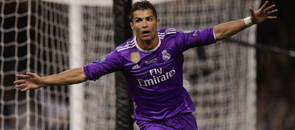 Real Madrid's Portuguese striker Cristiano Ronaldo celebrates after scoring their third goal during the UEFA Champions League final football match between Juventus and Real Madrid at The Principality Stadium in Cardiff, south Wales Real Madrid's Portuguese striker Cristiano Ronaldo celebrates after scoring their third goal during the UEFA Champions League final football match between Juventus and Real Madrid at The Principality Stadium in Cardiff, south Wales - Sputnik International