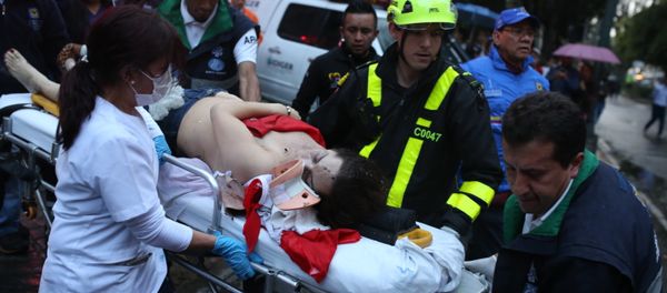 A woman is evacuated on a gurney after an explosion at the Centro Andino shopping center in Bogota, Colombia, Saturday, June 17, 2017. - Sputnik International