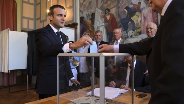 French President Emmanuel Macron casts his ballot as he votes at a polling station in Le Touquet, northern France, during the second round of the French parliamentary elections (elections legislatives in French) French President Emmanuel Macron casts his ballot as he votes at a polling station in Le Touquet, northern France, during the second round of the French parliamentary elections (elections legislatives in French) - Sputnik International