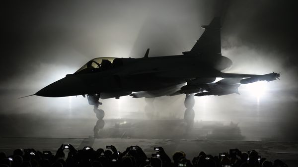 The new E version of the Swedish JAS 39 Gripen multi role fighter being rolled out at SAAB in Linkoping, Sweden - Sputnik International